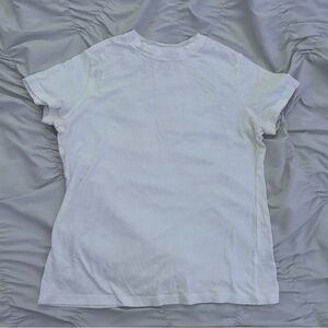 A New Day white tee